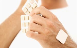 Person with nicotine replacement therapy patch
