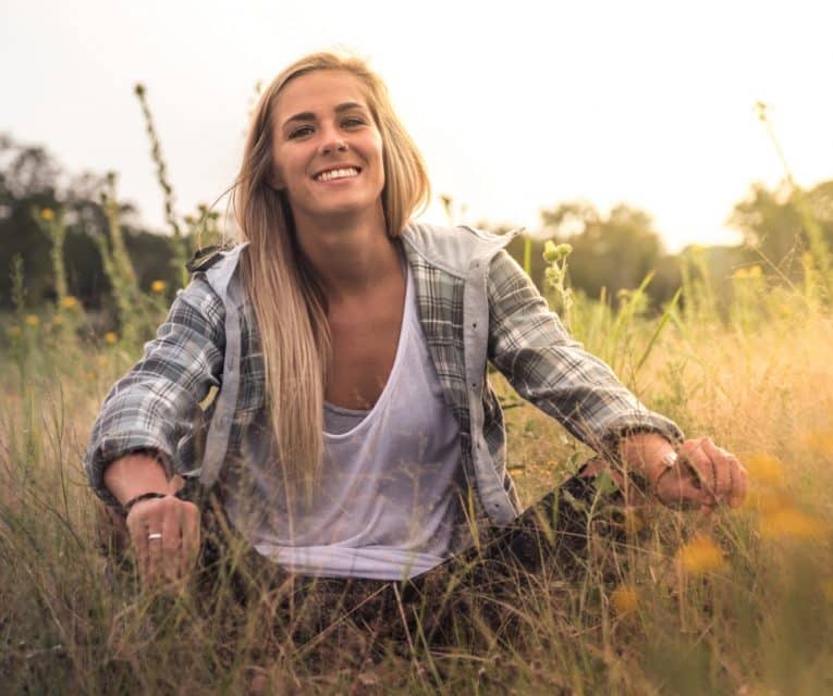 women sitting in nature enjoying being free of their addiction or issue